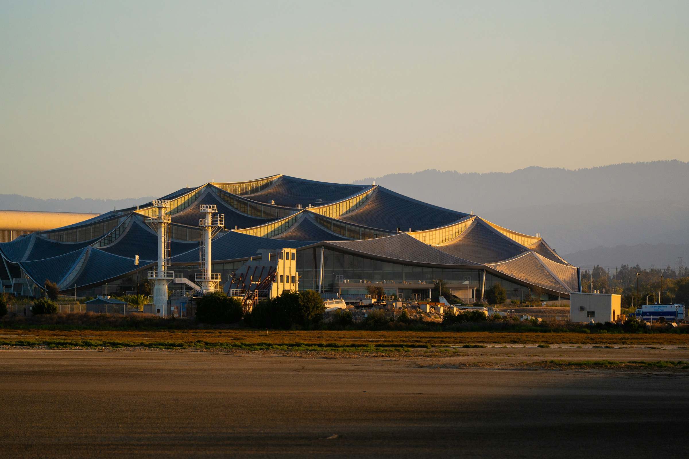 Modern canopy-roofed campus building in Mountain View at golden hour